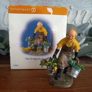 Department 56 Gardener Figurine in Yellow Shirt with Green Plants